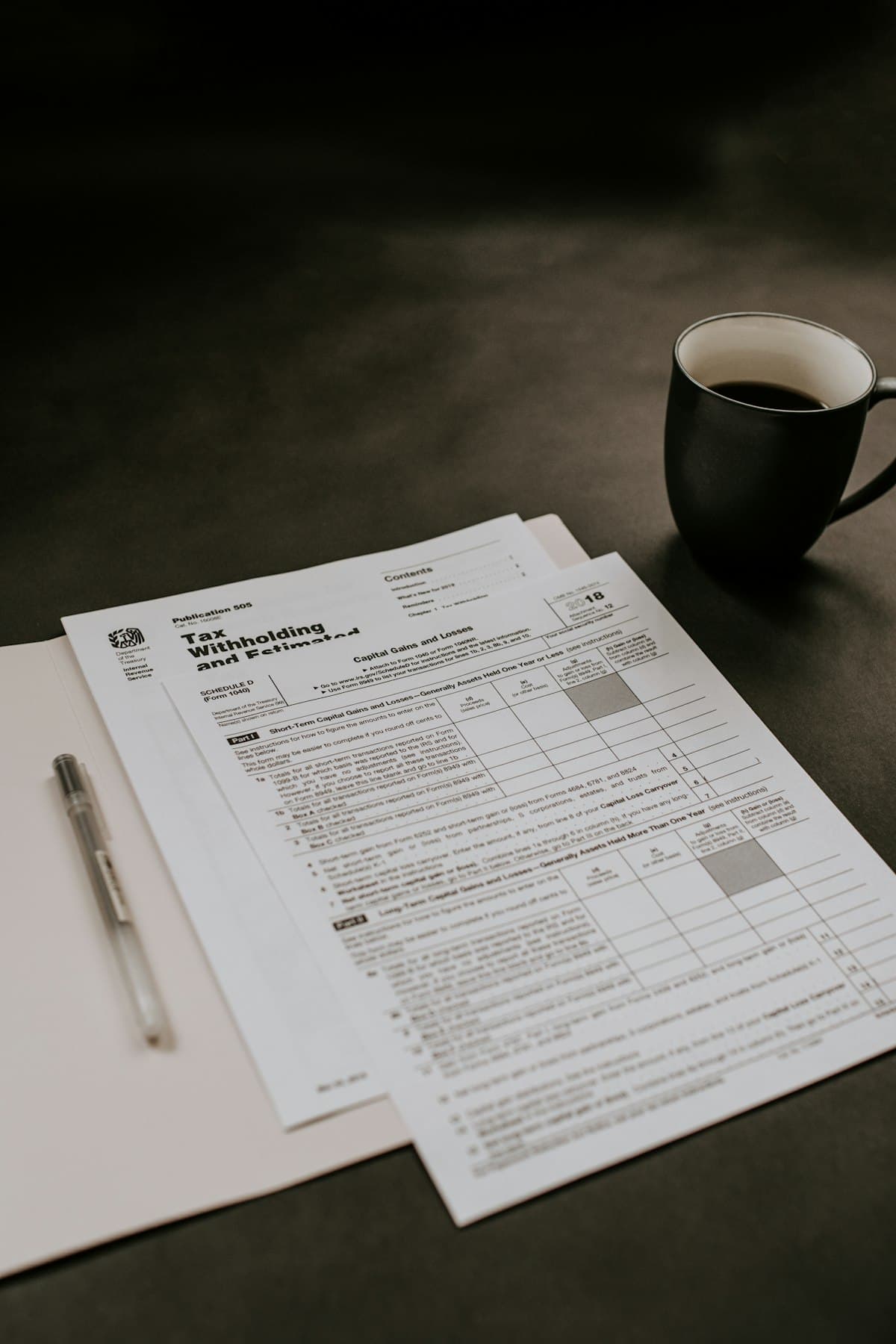 A notebook of figures beside a calculator